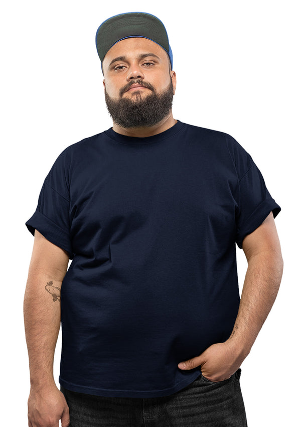 Image of Model wearing an oversize men's navy blue t-shirt from the perfect tshirt co with sizes up to 6XL