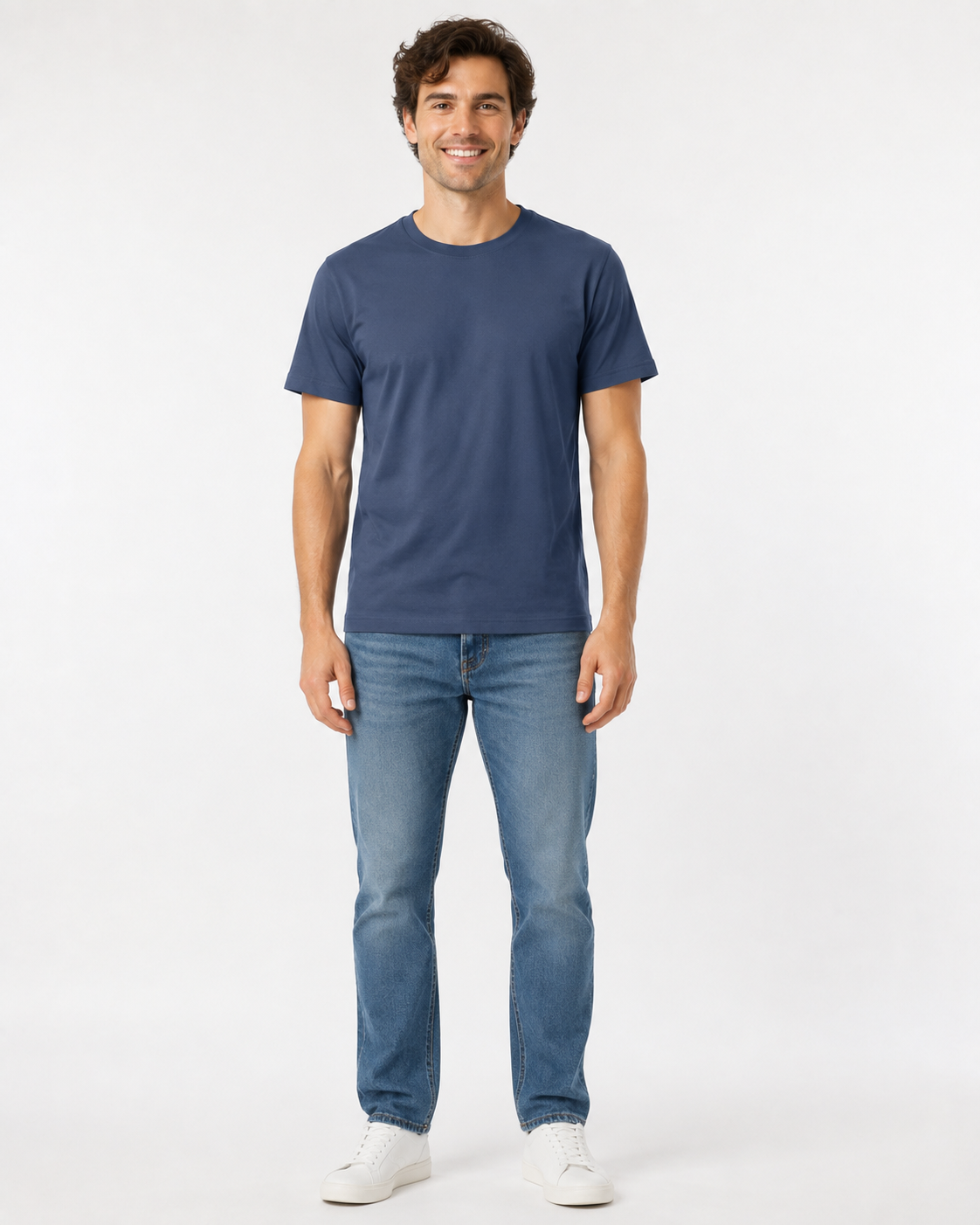 men's indigo blue t-shirt and blue jeans and whtite sneakers on a white background
