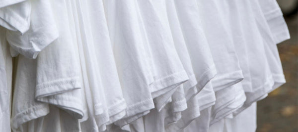 mens-white-tshirt-hanging up