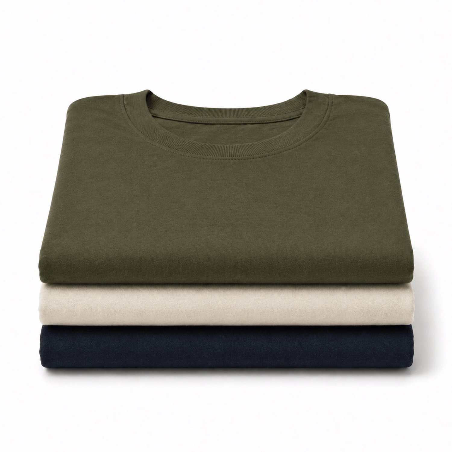 Three folded crewneck t-shirts stacked vertically on a white background, in olive green, cream, and navy blue.
