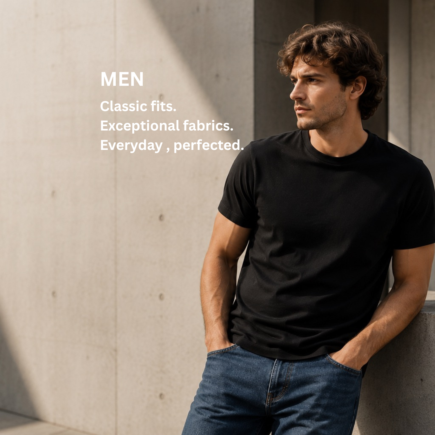 A man wearing a black short-sleeve crewneck t-shirt and blue jeans leans against a concrete wall, with white text on the left reading 'MEN Classic fits. Exceptional fabrics.