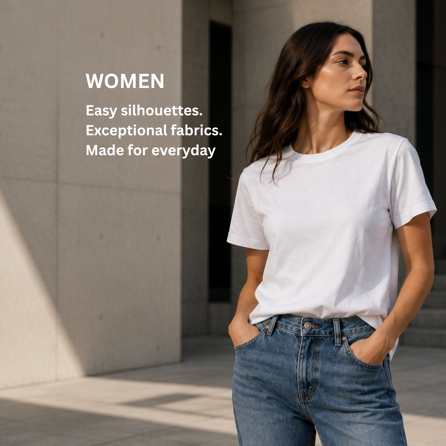 A woman wearing a white short-sleeve crewneck t-shirt and blue jeans stands outdoors against a concrete wall, with text on the left reading 'WOMEN Easy silhouettes. Exceptional fabrics.